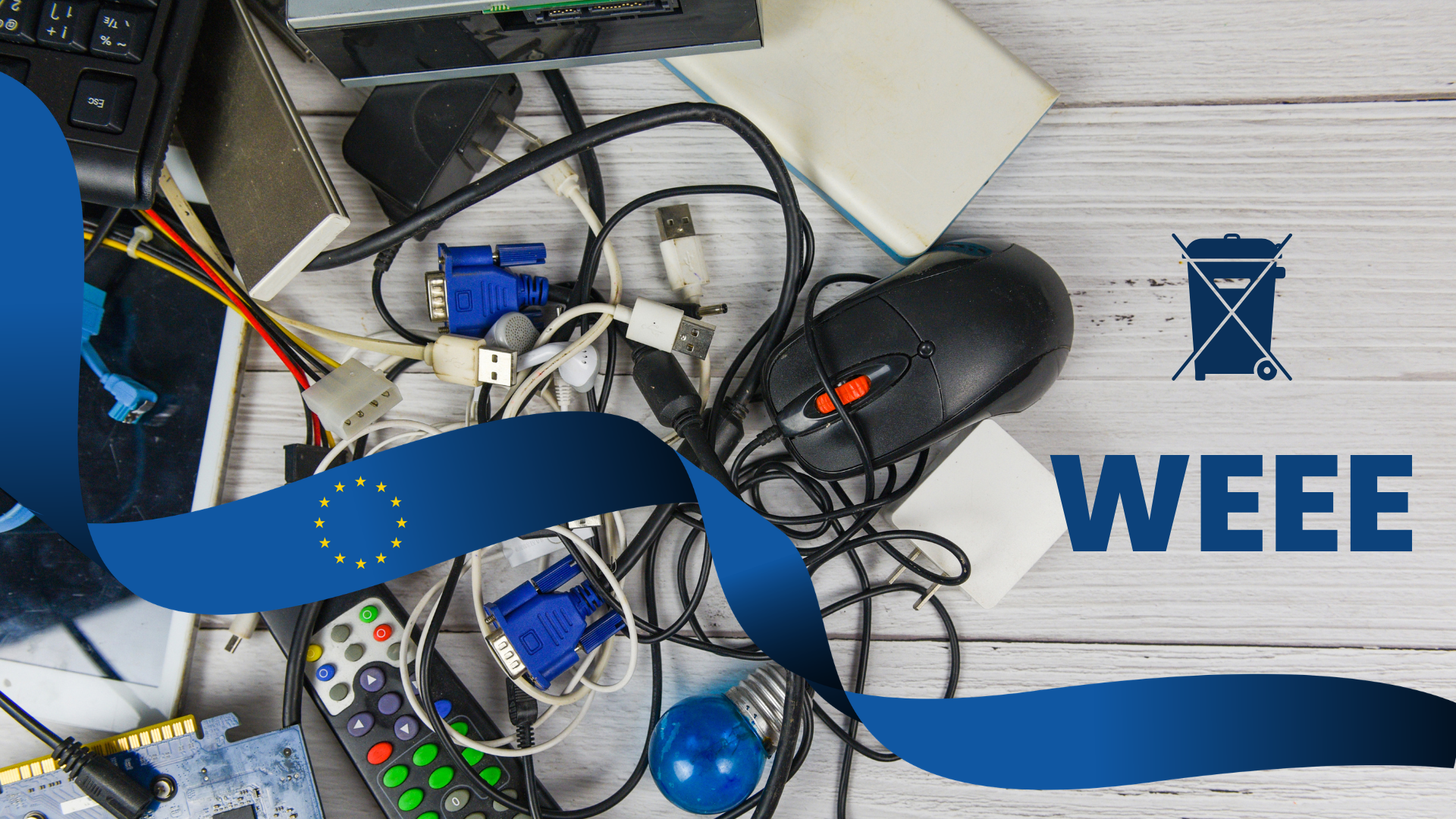 Cables enredados, conectores USB y VGA, ratón y mando sobre una mesa blanca, junto al contenedor tachado y la palabra WEEE